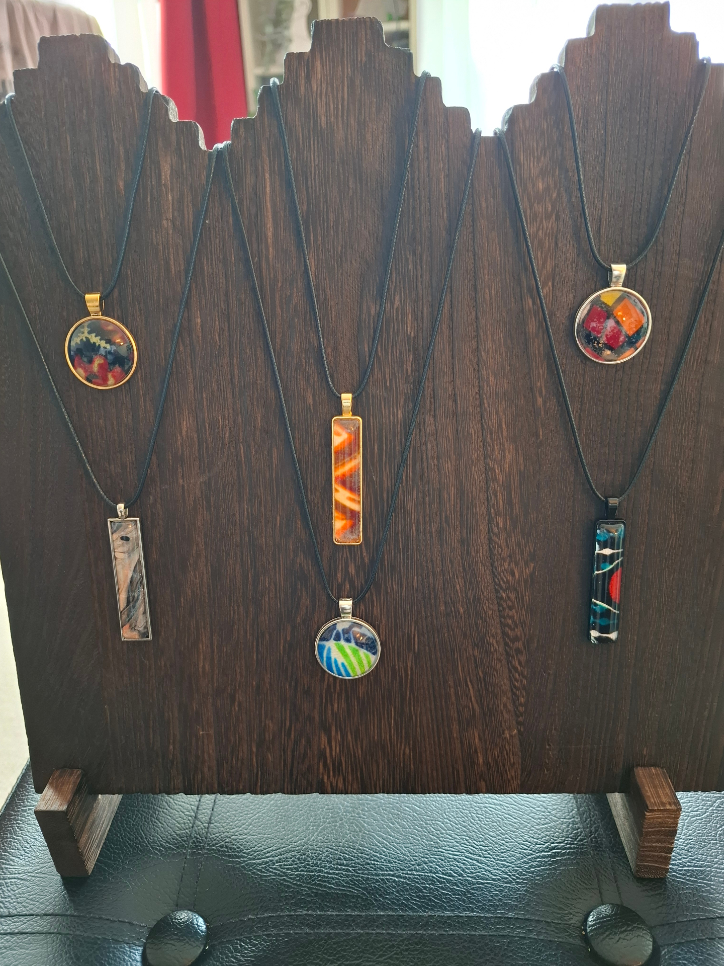 Necklace display on a wooden stand